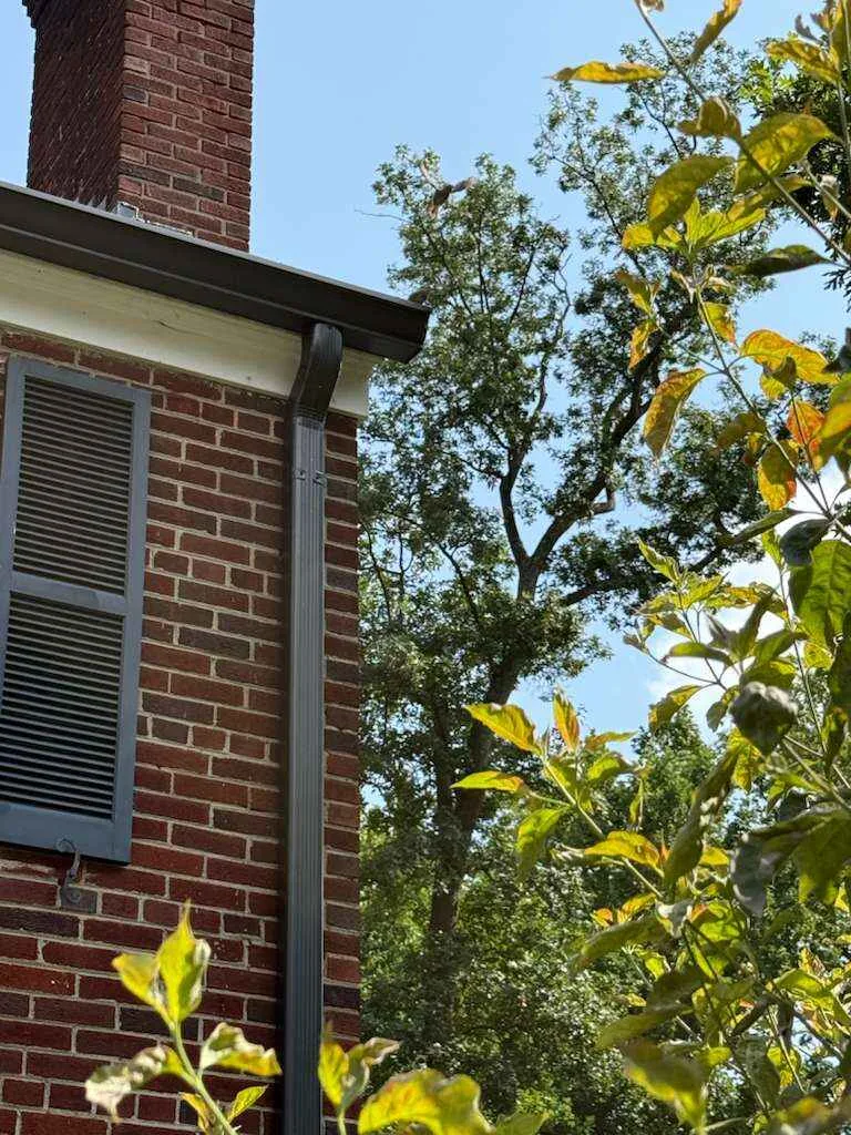 Aluminum seamless gutters in silver color by HF Roofing