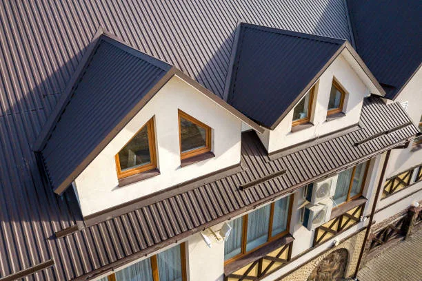 Side-by-side comparison of a metal roof and traditional asphalt shingles on homes in Germantown, highlighting energy efficiency and durability.