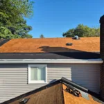 Exposed plywood roof deck after tear-off, ready for underlayment
